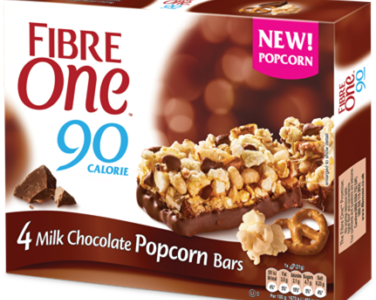 A box of 4 Fibre One 90 Calorie milk chocolate popcorn bars.